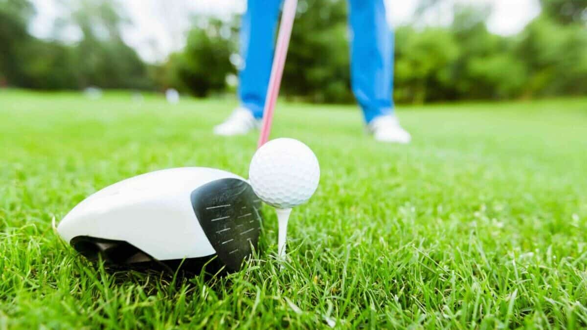 Close up of a golf driver on a tee
